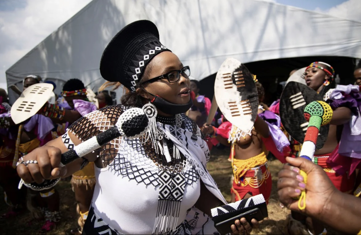 A woman leads Zulu maidens in dance during the memorial of King Goodwill Zwelithini at the KwaKhethomthandayo Royal Palace.